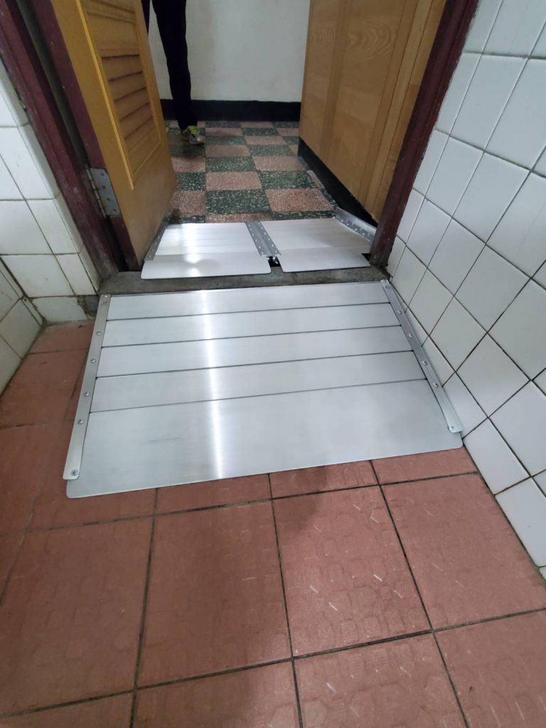 To push potty chair cross bathroom's threshold.