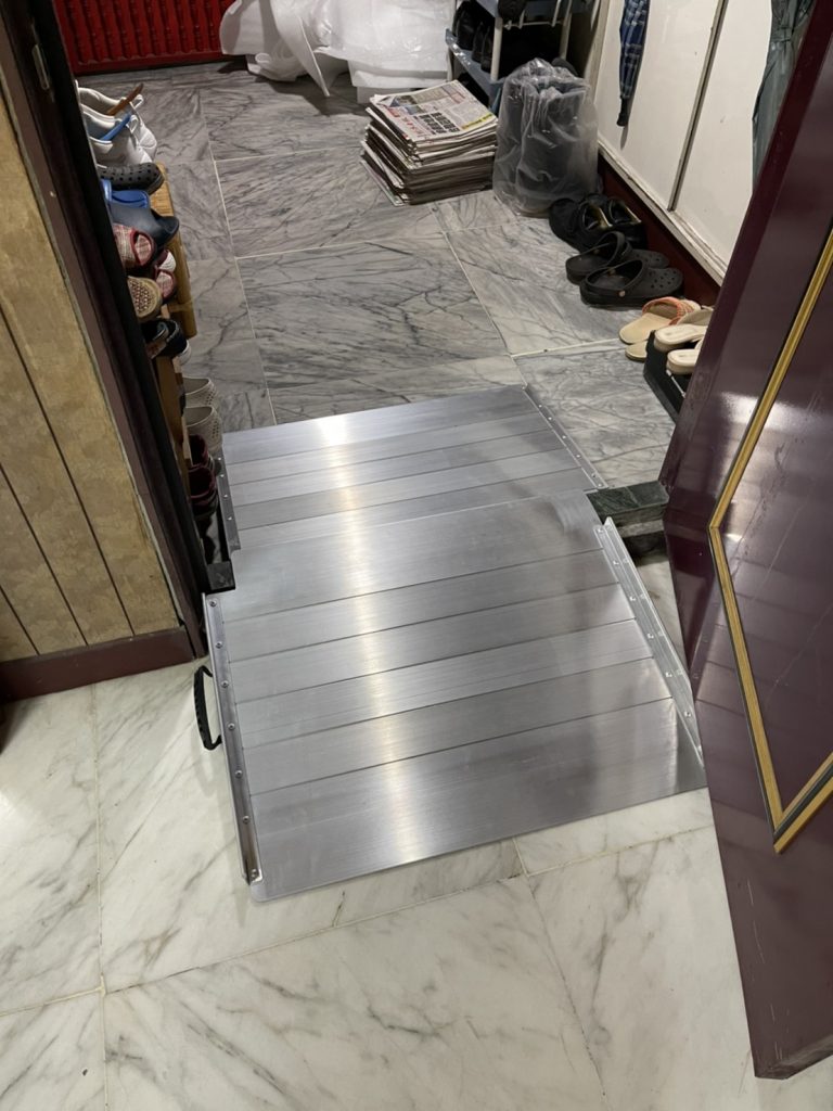 One side has a Portable Single Ramps, and the other side has a Threshold Ramps with fine-tune adjustable legs.