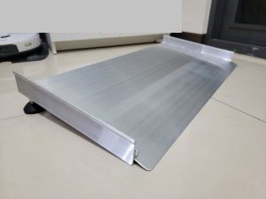 Support on both edges avoiding swepping robot falling from ramp.