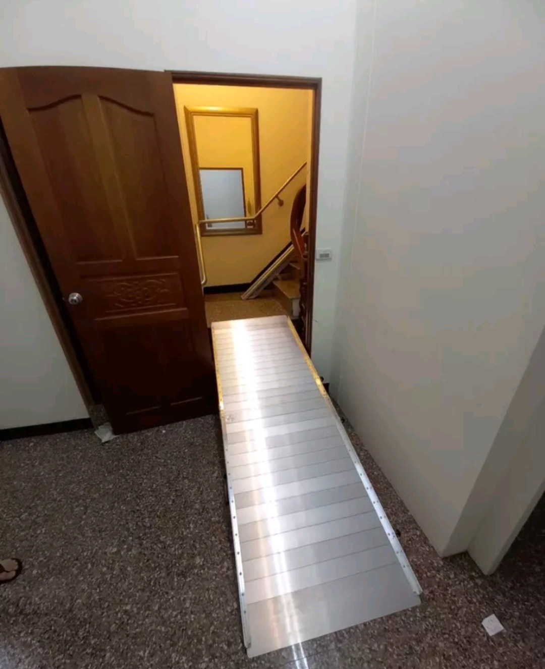 The last mile before stairlifts are often assisted by accessible ramps